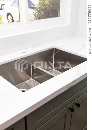 Custom Quartz Countertop, Sink Installation at the Kitchen, No Faucet. Bright window, Green Wood Cabinets. Plumbing Service. Cozy Home Design. Building Material. Vertical. Appliances. White Tiles Custom Quartz Countertop, Sink Installation at the Kitchen, No Faucet. Bright window, Green Wood Cabinets. Plumbing Service. Cozy Home Design. Building Material. Vertical. Appliances. White Tiles 119776632
