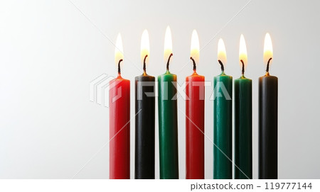 Red, green, and black candles lit 119777144
