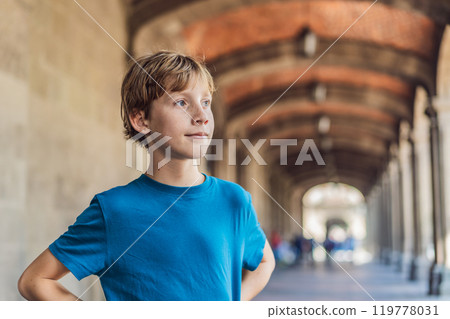 Teenage boy tourist in the central square of Mexico City, Zocalo. Family travel, cultural exploration, and historic architecture concept 119778031