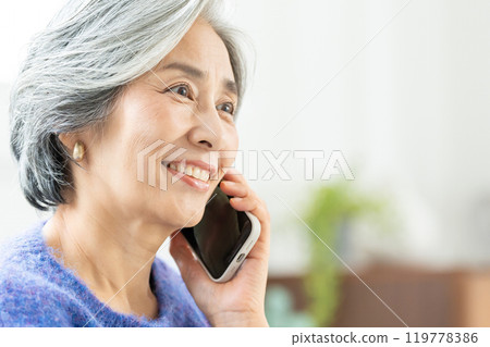 Senior woman talking on smartphone Senior woman talking on smartphone 119778386