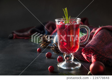 Christmas cranberry and apple mulled wine garnish rosemary and fir branches on black background. Close up. Xmas drink. 119778648