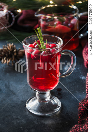 Christmas cranberry cocktail garnish rosemary and fir branches on black . Close up. Xmas drink. 119778649