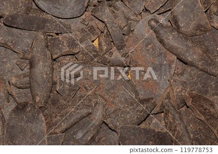 Grated cocoa background, top view, texture. Grated cocoa is one of the ingredients in making chocolate at home. Close-up of crushed cocoa, top view. Grated cocoa background, top view, texture. Grated cocoa is one of the ingredients in making chocolate at home. Close-up of crushed cocoa, top view. 119778753