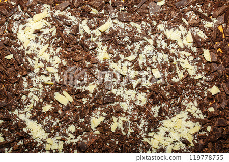 Cocoa butter and cocoa mass, top view, texture. Basic ingredients for making chocolate at home. Close-up of chopped food, top view. 119778755