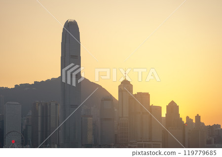HONG KONG, CHINA - November 27, 2023: Hong Kong downtown skyline across Victoria harbor at sunset time, Hong Kong, China. Golden hour. 119779685
