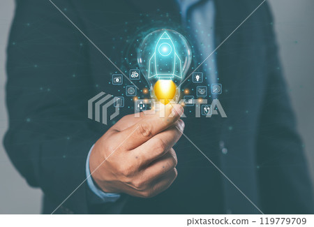Big data concept: hand-holding light bulb (idea) with rocket launch, global internet connection application technology, digital marketing, financial and banking, digital technology nomads. 119779709
