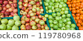 Fruits, green and red apples and tangerine in box on the market. 119780968