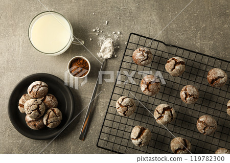 Delicious crinkle cookies on a baking sheet. 119782300