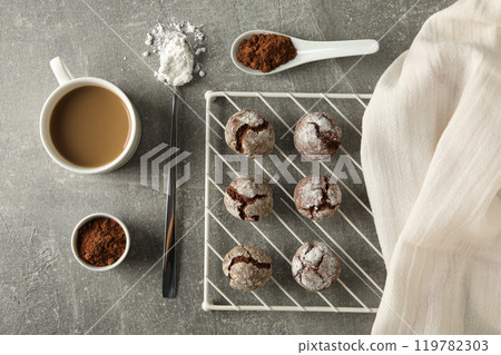 Delicious crinkle cookies on a baking sheet. 119782303