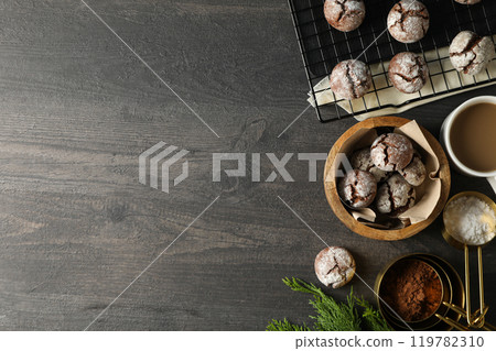 Delicious crinkle cookies in a plate, on a dark background. Delicious crinkle cookies in a plate, on a dark background. 119782310