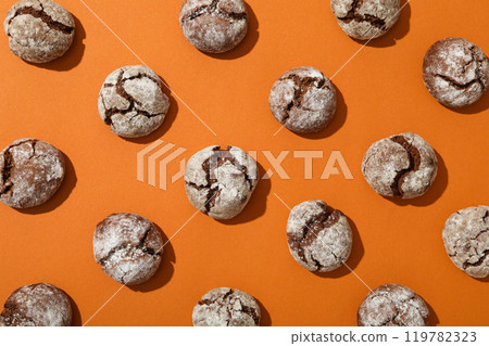 Appetizing Grinkle cookies on an orange background. Appetizing Grinkle cookies on an orange background. 119782323