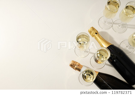 A bottle of champagne with glasses on a light background 119782371