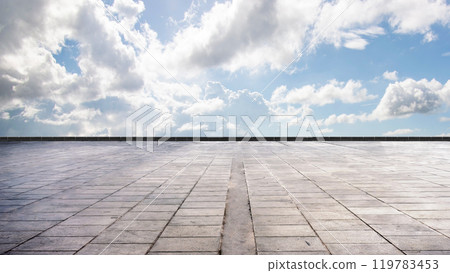 Cement floor view with blue sky and clouds in the background Cement floor view with blue sky and clouds in the background 119783453