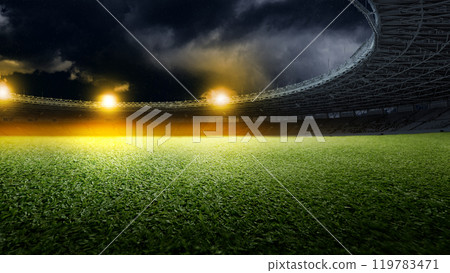 Empty football stadium with green field and spotlights. The field is ready for a game 119783471