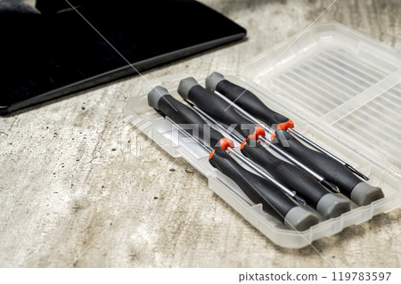 Closeup view of screwdriver set on the box for repairing electronic goods on the table 119783597