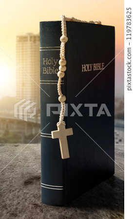 Book of Holy Bible and rosary beads. Symbol of faith and worship in God Book of Holy Bible and rosary beads. Symbol of faith and worship in God 119783625