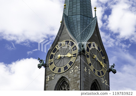 Close view of clock tower with blue sky in Zurich, Switzerland 119783922