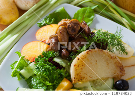 Salad of chicken hearts with peach, pear, fried cheese 119784023