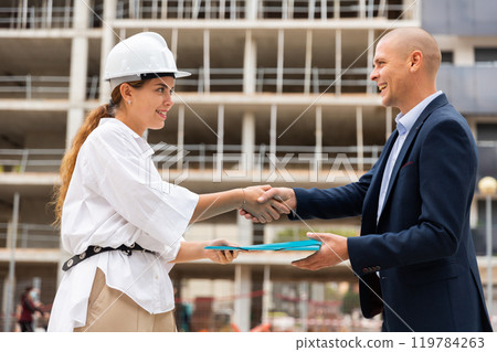 Man receiving keys to apartment from real estate manager 119784263
