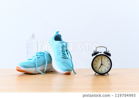 Light blue sneakers, clock and water Background material Background Athletic shoes 119784993