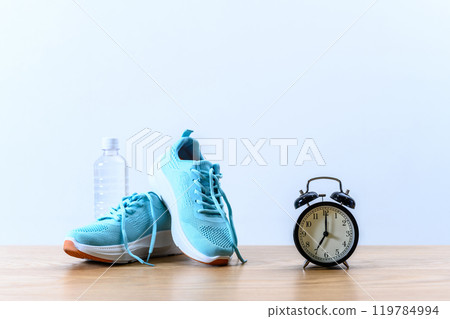 Light blue sneakers, watch and water Background material Background Athletic shoes Blue and strong shadow 119784994