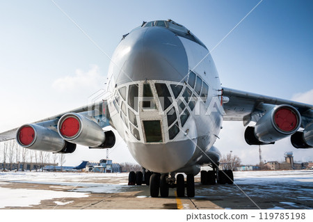 Close-up front view of wide body cargo transport aircraft in a cold winter airport 119785198