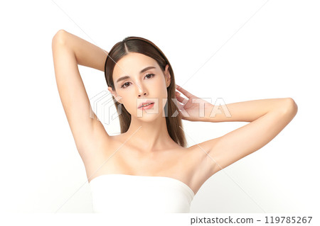 Beautiful Young Asian woman lifting hands up to show off clean and hygienic armpits or underarms on white background, Smooth armpit cleanliness and protection concept 119785267