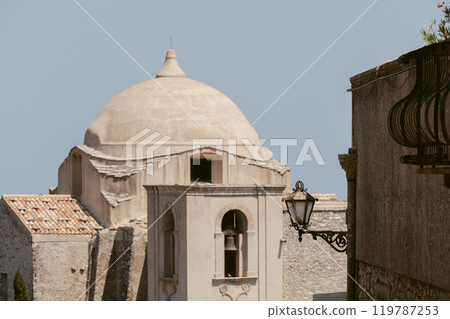Historic stone church and bell tower in Italy 119787253