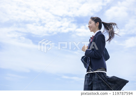 Students running under the blue sky Students running under the blue sky 119787594