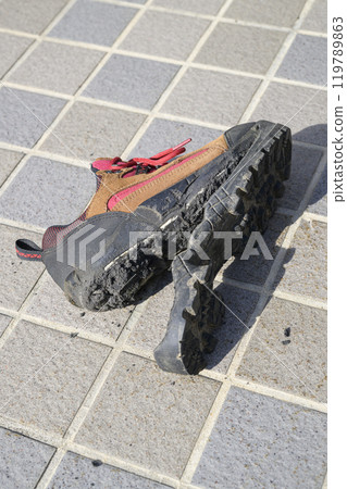 Hiking shoes with torn soles Hiking shoes with torn soles 119789863