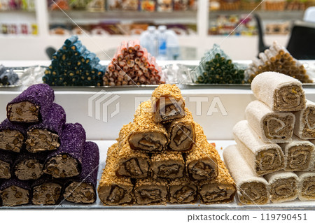 Various Turkish sweets in confectionery shop window. Traditional Turkish Delight (Rahat Lokum) with nuts and sweets. 119790451