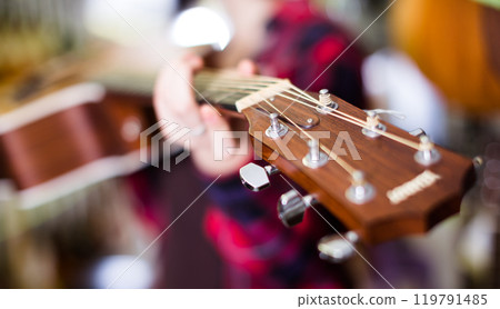 Close up of wooden head of guitar 119791485