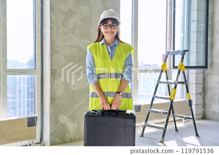 Portrait of female industrial worker builder engineer supervisor at construction 119791536