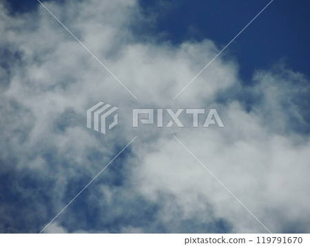 white cumulus cloud on blue sky in blurry focus as natural airy texture, floating light clouds on bright sky vault as background backdrop full frame white cumulus cloud on blue sky in blurry focus as natural airy texture, floating light clouds on bright sky vault as background backdrop full frame 119791670