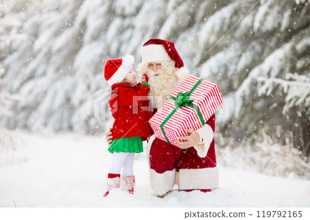Kids and Santa with Christmas gifts in snow forest Kids and Santa with Christmas gifts in snow forest 119792165