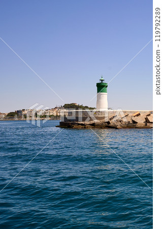 White and green lighthouse in the sea. White and green lighthouse in the sea. 119792289