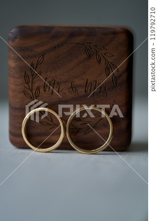 Stylish ring box with gold wedding rings close up Stylish ring box with gold wedding rings close up 119792710
