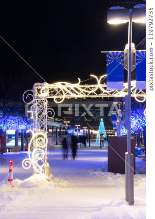 Illuminated street corner at night 119792735