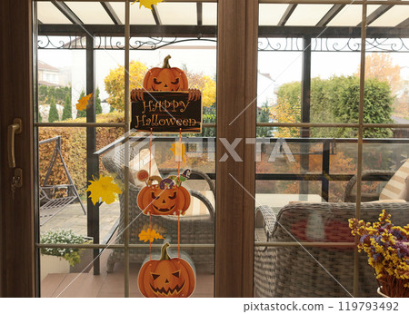 Happy Halloween. Composition with pumpkins and window. Background for design.  119793492