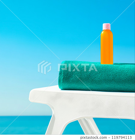 Bright Summer Beach Scene with Towel and Bottle Bright Summer Beach Scene with Towel and Bottle 119794113