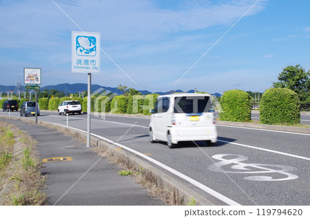 Cars passing one after another on Melody Road along Yonago Kitaro Airport in Sakaiminato City, Tottori Prefecture Cars passing one after another on Melody Road along Yonago Kitaro Airport in Sakaiminato City, Tottori Prefecture 119794620