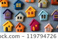 Colorful felt houses create a whimsical community on soft gray felt surface for educational purposes 119794726