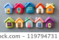 Colorful felt houses arranged on a soft gray felt surface for a creative community theme 119794731