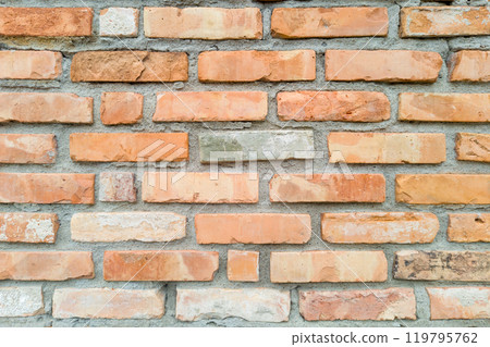 Varied Orange and Beige Brick Wall with Rustic Texture 119795762