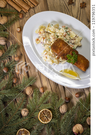 Christmas fried carp with potato salad 119796351