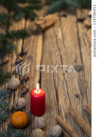 Traditional Czech Christmas on wood decoration with twig, candle, apple, orange, fruit 119796451