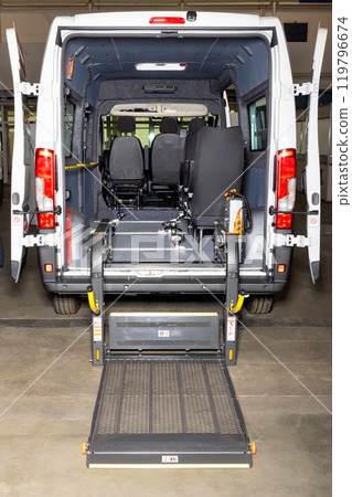 Wheelchair lift equipped van offering accessible transportation. Wheelchair lift equipped van offering accessible transportation. 119796674