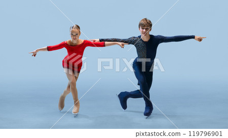 Confident and synchronized pose from young figure skating duo, highlighting their competitive spirit and precision. 119796901