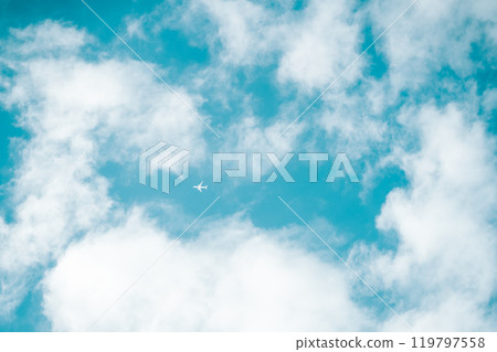 Clouds floating in the blue sky and a small plane Clouds floating in the blue sky and a small plane 119797558