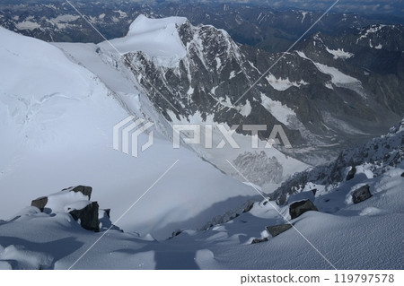 Tranquil Lake With Lush Green Forest, Snow-Capped Mountain, Blue Sky And White Clouds Tranquil Lake With Lush Green Forest, Snow-Capped Mountain, Blue Sky And White Clouds 119797578